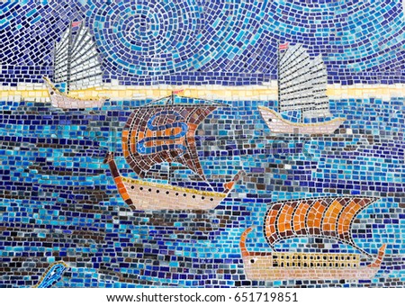 Stone mosaic of sailboats in the sea