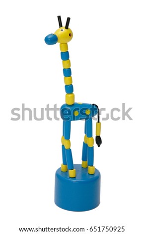 Bright multi-colored giraffe figurine carved from a tree on a white background