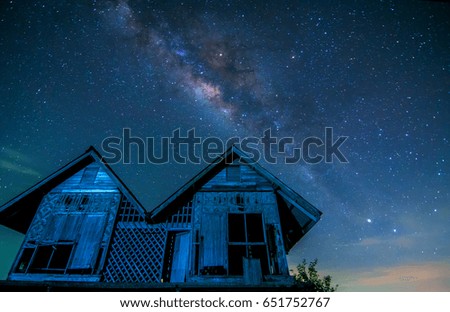 abandoned old farmhouse  in  songkhla lake thailand  in the  night with milky way and brilliant stars on the sky .