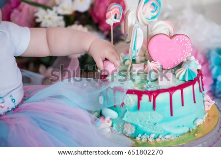 Baby eating cake, dirty hands