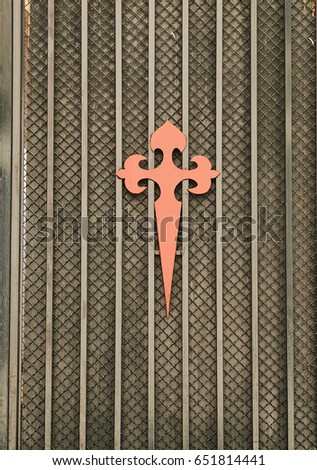 Cross of Saint james in a metal door