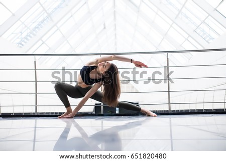 Yoga woman practice in a training hall background. Yoga concept.