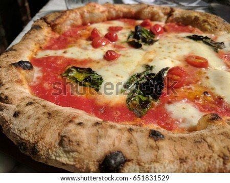 Margherita pizza fresh and hot out of the wood oven