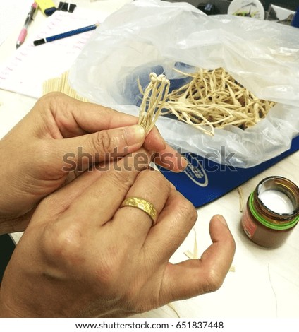  woman's hand prepared Thai Funeral Flower, artificial flower used for cremation