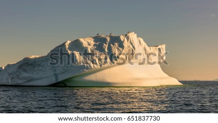 Greenland. Fancy icebergs of different forms in the Disko Bay. Their source is by the Jakobshavn glacier. This is a consequence of the phenomenon of global warming and catastrophic thawing of ice