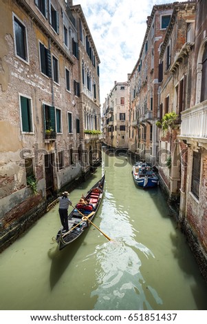 Gondole in chanel of Venice, Italy.
