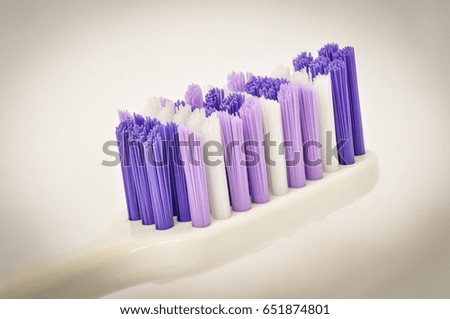a purple toothbrush with vignetting