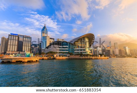 cityscape in Hong Kong with illuminated buildings. Victoria harbour at sunset in Hong Kong
