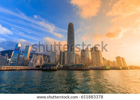 cityscape in Hong Kong with illuminated buildings. Victoria harbour at sunset in Hong Kong
