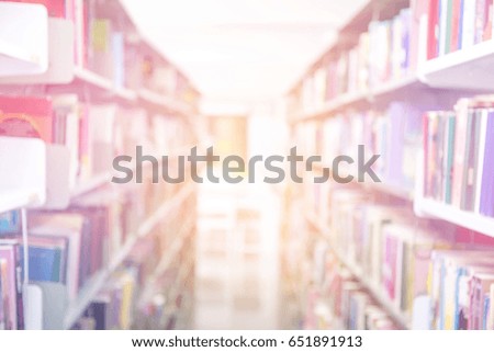 blur books on bookshelf in university or public library room, abstract blur background and space for text.concept for education,background.