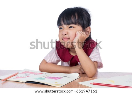 Asian Little Chinese girl drawing with color pencils in isolated white background
