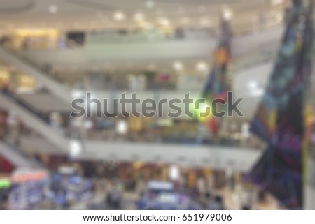 Abstract blur supermarket and retail store in shopping mall interior for background.