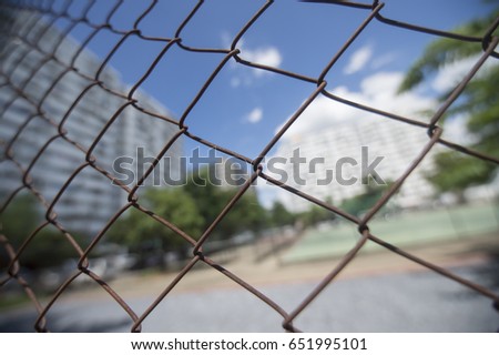 net fence with city background