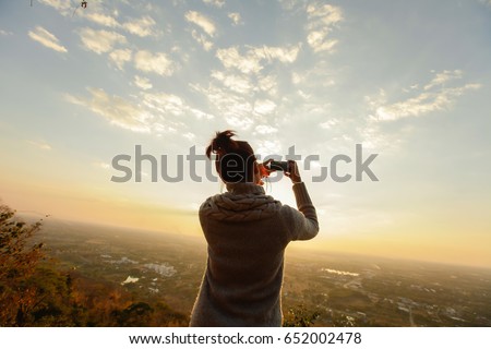 Women selfie landscape sunset.