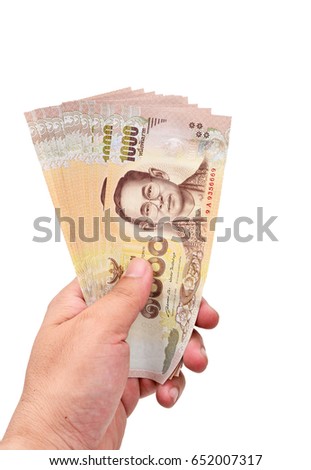 1,000 baht Thai money hold in hand