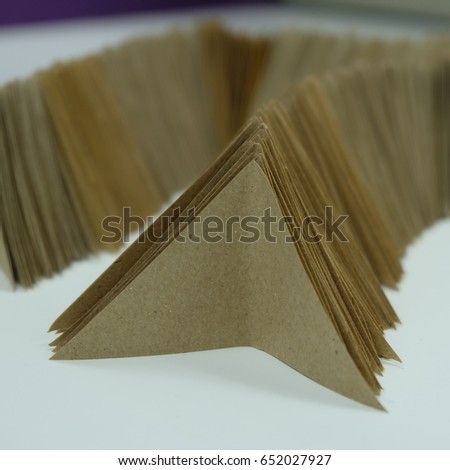 Triangular paper with brown color.