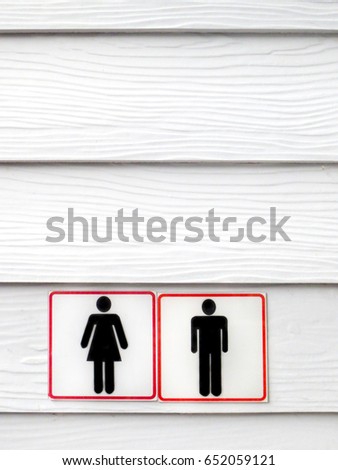 Black and red toilet sign on white slide wood texture
