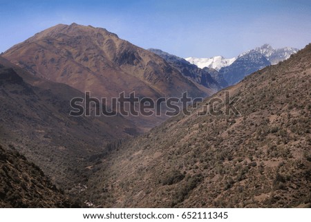 Andes mountain range with snow on the peaks. 
