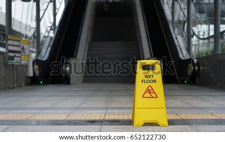 Warning Yellow sign wet floor 