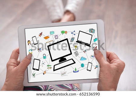 Network communication concept shown on a tablet held by a woman