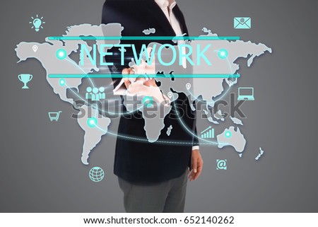 Businessman presses a business network icon on virtual hexagons screen. Businessman toched a social network button on touch screen. Communication, connection, networking, communication, technology.