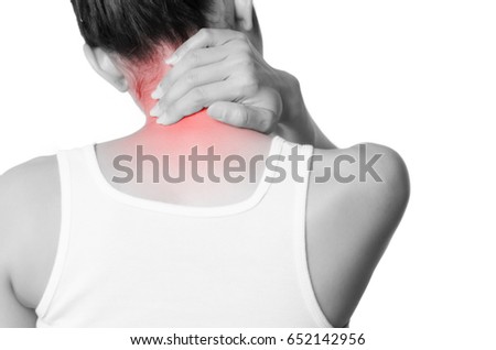 rear view of a young women holding her neck in pain. isolated on white background. monochrome photo with red as a symbol for the hardening.