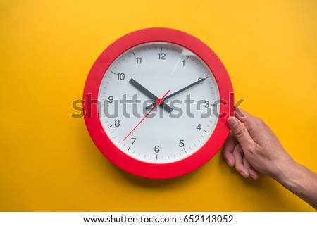 Time management concept over yellow background