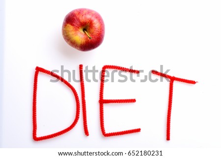 Diet word written with red letters using apple as dot above, isolated on white background