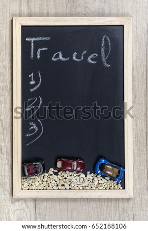 Space chalkboard background texture with wooden frame with the word "Travel". blackboard space for wallpaper. Landscape mounting style vertical.
