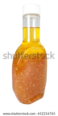 Isolated jar of Italian salad dressing. Vertical. Royalty-Free Stock Photo #652216765