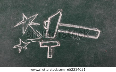 Hammer and anvil with sparks, stars on chalkboard, blackboard background and texture