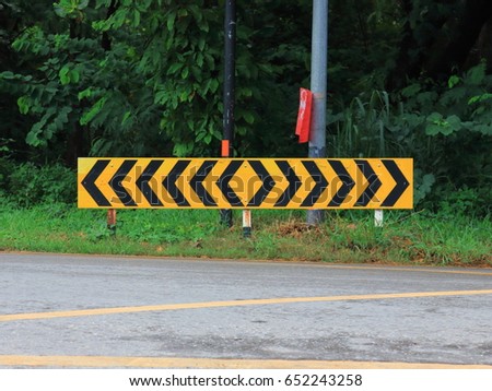 yellow and black traffic sign