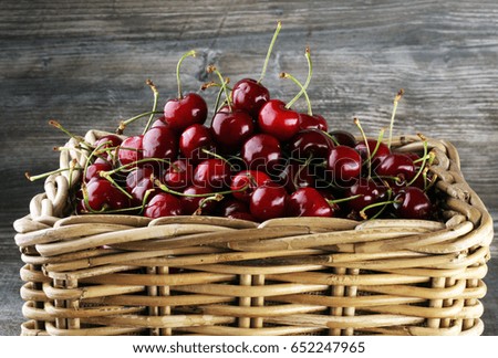 Cherry basket / Sweet cherry background/ cherry with leaf on grey