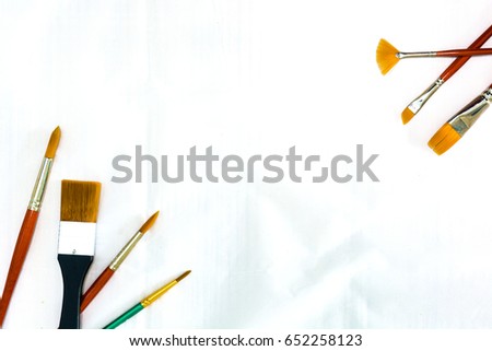 Painting brushes placed on white background