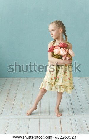 Emotional portrait of girl preschool . ?dorable preschooler in yellow dress