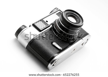 Old camera on white background isolated