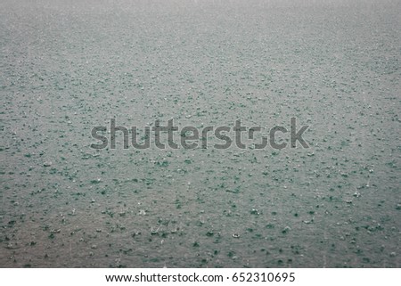 Surface of water in rain drops at Chieou Laan lake  in Thailand