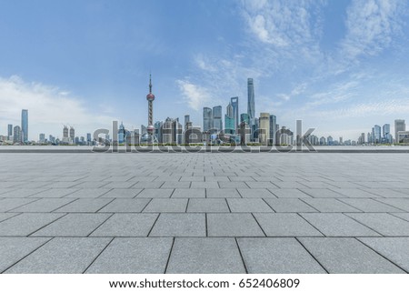 cityscape and skyline of shanghai in blue sky from empty floor
