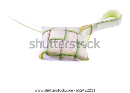 Ketupat or rice dumpling isolated on white background. Made of rice wrapped in coconut leaves before boiling until cooked. 