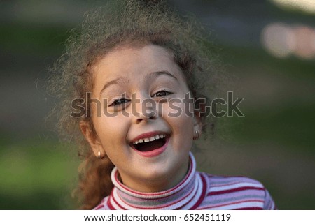 The little girl smiles