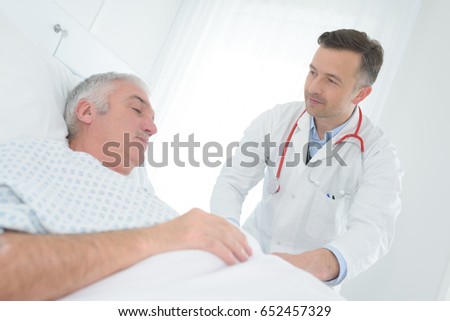 doctor inspecting the patient