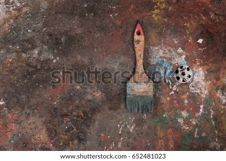 Abstract background of old dried paint, paint brush, oil paint