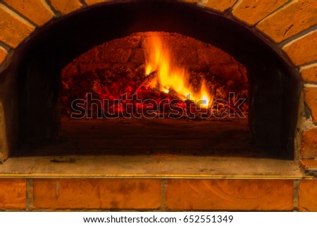 Fire and burn coals in stone ovens. Oven made of brick and clay on the wood. Oven for pizza. Brick oven.