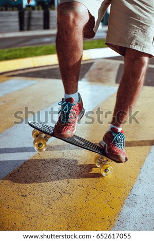 Man with skateboard. Boy skateboarding. Skateboard on asphalt. 