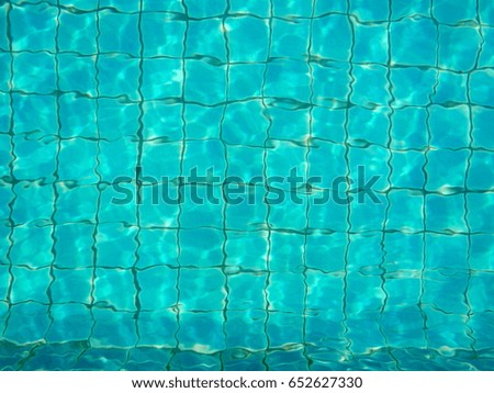 Water in the swimming pool with a wave.