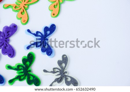 Images of butterflies made of colorful felt fabrics. Isolated on white background. 