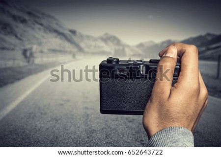 Man with camera in hands