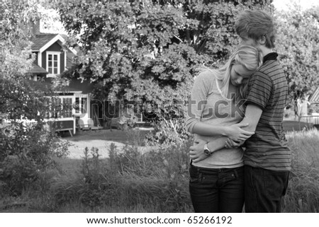 Young teenage couple hugging