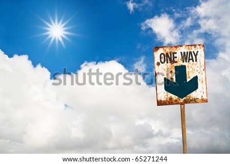 one way sign on sun cloud sky