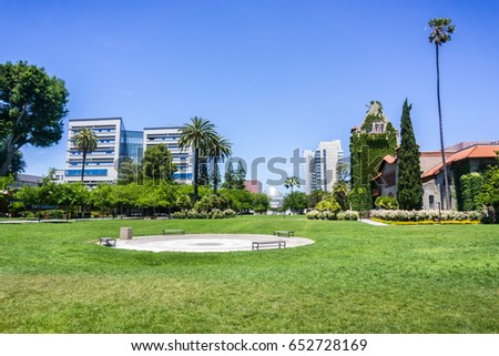 Landscape in the San Jose State University campus; modern buildings in the background; San Jose, California